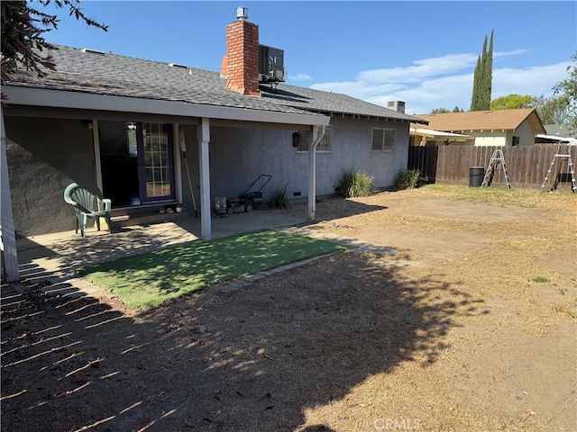 500 Sherri Way, Turlock, CA 95382 - rear view of house featuring roof with shingles, a chimney, a patio area, and central AC