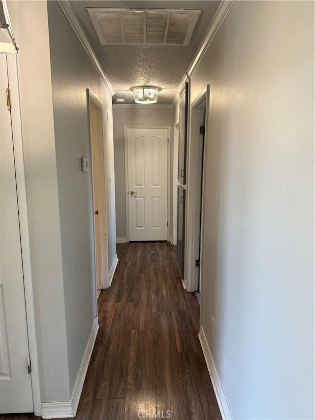 500 Sherri Way, Turlock, CA 95382 - hallway featuring crown molding, dark wood finished floors, and baseboards