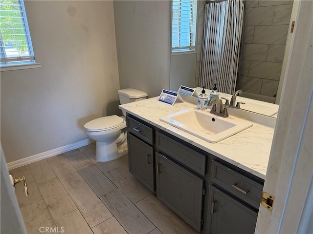 500 Sherri Way, Turlock, CA 95382 - full bath with vanity, toilet, baseboards, and a shower with curtain