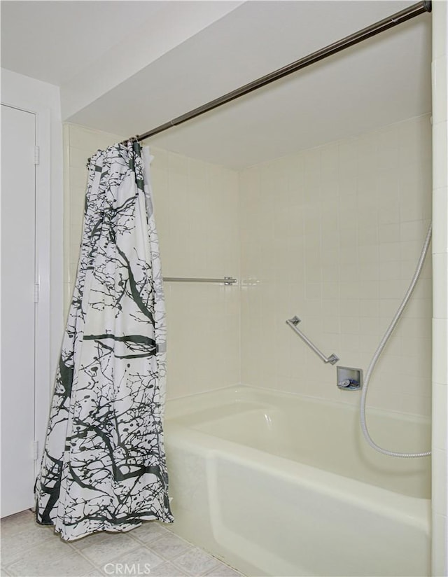 full bathroom featuring a bathtub and a shower with curtain