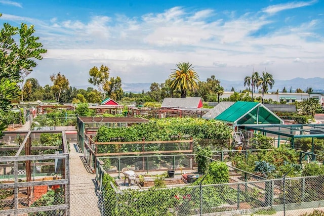 view of property's community with a garden