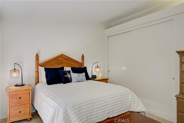 bedroom featuring a closet and a textured ceiling