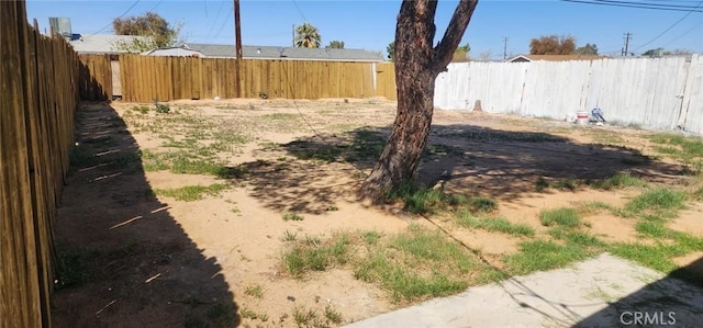 view of yard featuring a fenced backyard