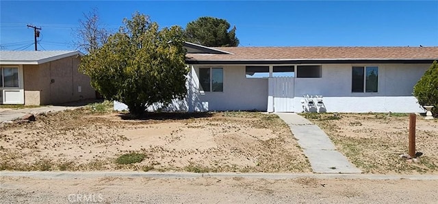 single story home with stucco siding