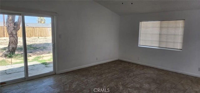 spare room featuring baseboards