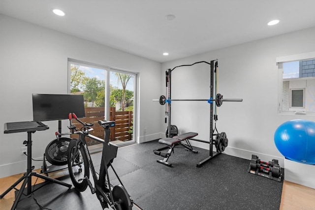 workout area with recessed lighting and baseboards