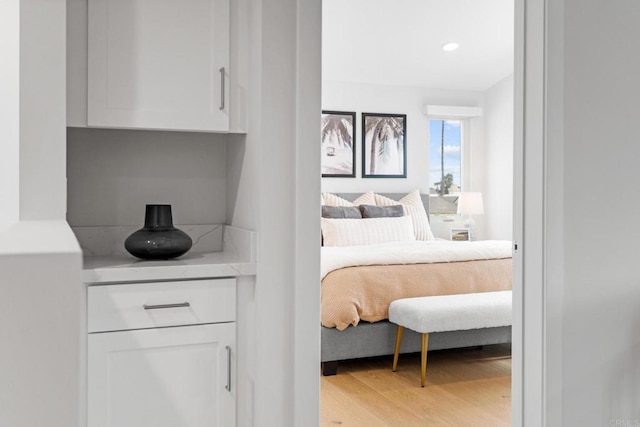 bedroom featuring light wood-style floors and recessed lighting