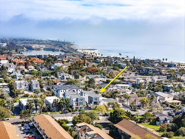 aerial perspective of suburban area with a large body of water