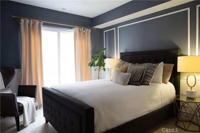 bedroom with wood finished floors