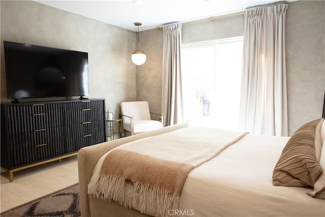 bedroom featuring wood finished floors