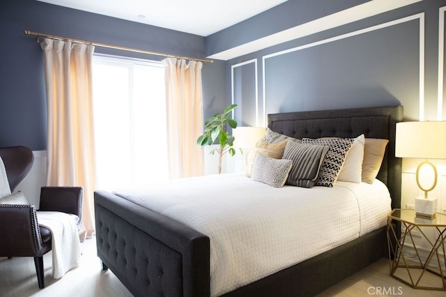 bedroom with wood finished floors
