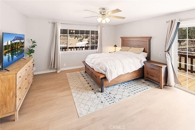 bedroom with a ceiling fan, light wood-style flooring, access to exterior, and baseboards
