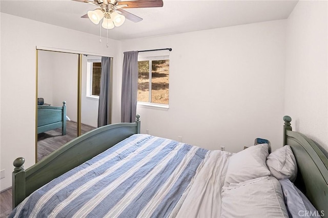 bedroom with a ceiling fan and wood finished floors