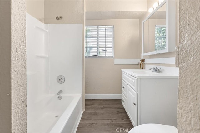 1335 N Lugo Ave, San Bernardino, CA 92404 - full bathroom featuring bathtub / shower combination, a textured wall, a wealth of natural light, and wood finished floors