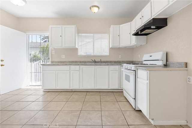 1335 N Lugo Ave, San Bernardino, CA 92404 - kitchen with under cabinet range hood, light countertops, a sink, white cabinetry, and white gas stove