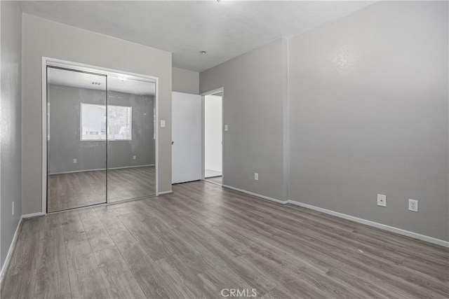 1335 N Lugo Ave, San Bernardino, CA 92404 - unfurnished bedroom featuring baseboards and wood finished floors