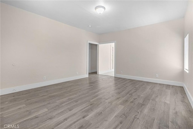 1335 N Lugo Ave, San Bernardino, CA 92404 - spare room featuring baseboards and wood finished floors