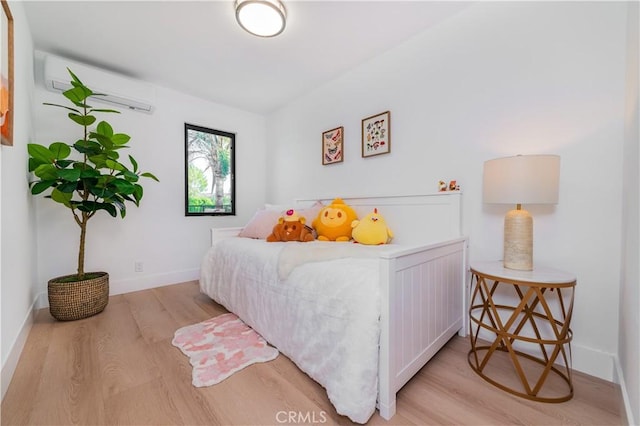 4912 Shaw Ln, Yorba Linda, CA 92886 - bedroom with wood finished floors, a wall mounted air conditioner, and baseboards