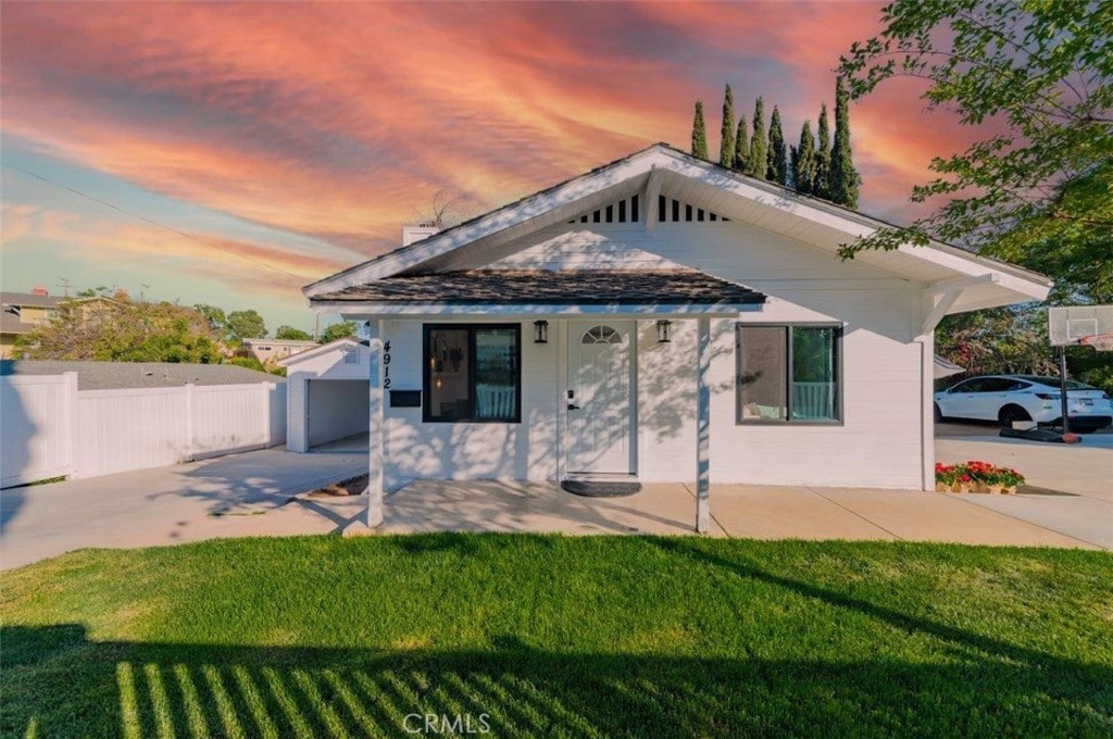 4912 Shaw Ln, Yorba Linda, CA 92886 - rear view of house featuring a porch and concrete driveway