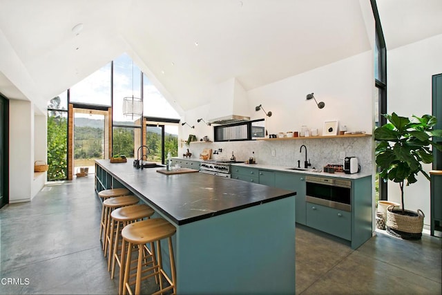11100 Sulphur Mountain Rd, Ojai, CA 93023 - kitchen with high vaulted ceiling, finished concrete flooring, range with two ovens, and open shelves