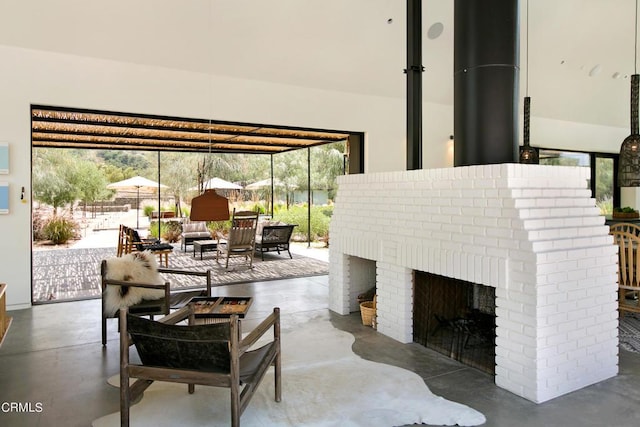 11100 Sulphur Mountain Rd, Ojai, CA 93023 - living area featuring a fireplace and concrete floors