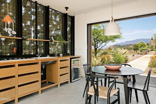 11100 Sulphur Mountain Rd, Ojai, CA 93023 - interior space with a mountain view, gas cooktop, pendant lighting, beverage cooler, and a sink