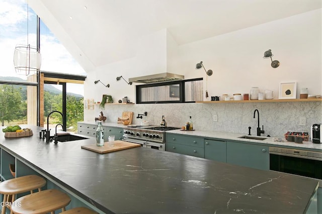 11100 Sulphur Mountain Rd, Ojai, CA 93023 - kitchen with premium range hood, range with two ovens, a sink, and open shelves