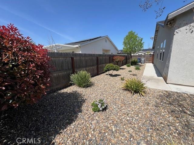view of yard featuring a patio area and a fenced backyard