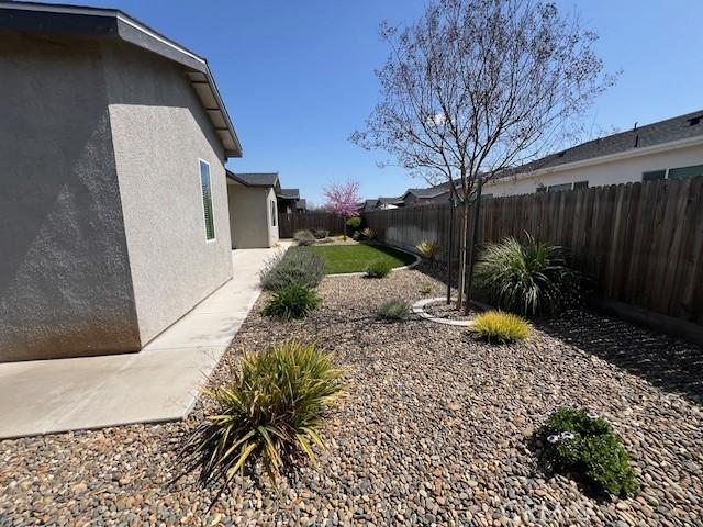 view of yard featuring a patio and a fenced backyard