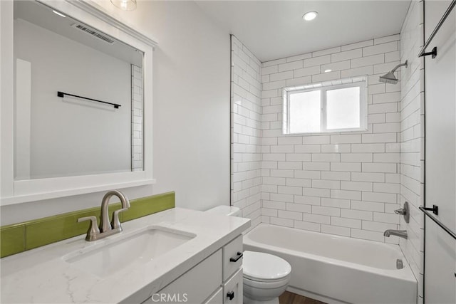 full bath with visible vents, toilet,  shower combination, recessed lighting, and vanity