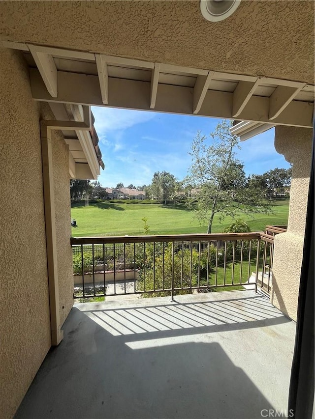 balcony featuring view of golf course