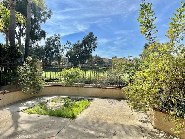 view of patio featuring fence