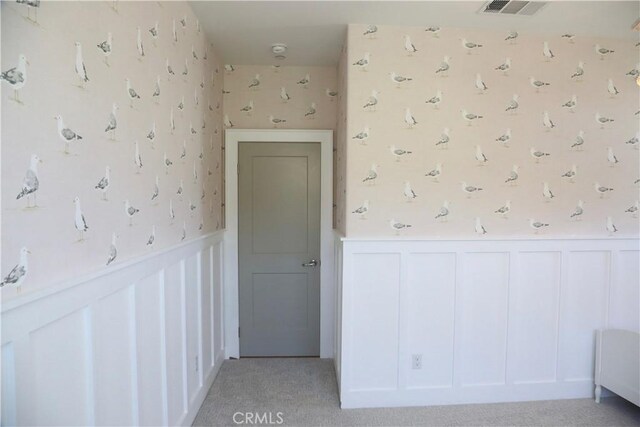 2493 Sierra Bella Dr, Corona, CA 92882 - bonus room featuring wallpapered walls, a wainscoted wall, light colored carpet, and a decorative wall