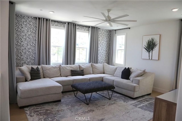 living room featuring baseboards, recessed lighting, ceiling fan, and wood finished floors