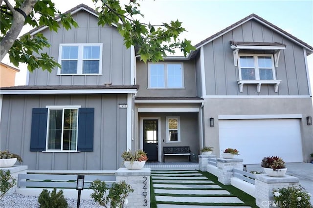 2493 Sierra Bella Dr, Corona, CA 92882 - view of front facade with board and batten siding and a garage