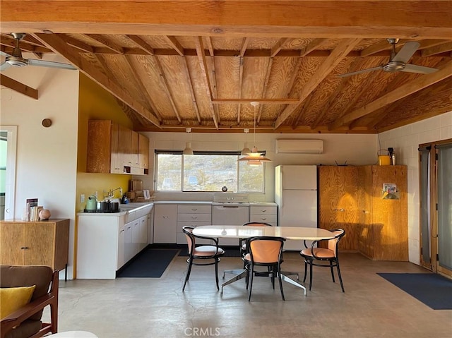 kitchen with a wall mounted AC, finished concrete flooring, freestanding refrigerator, and a ceiling fan