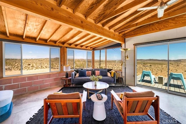 63465 Belmont St, Joshua Tree, CA 92252 - sunroom featuring a rural view, lofted ceiling with beams, a mountain view, and concrete flooring