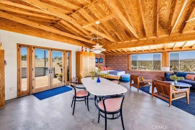 63465 Belmont St, Joshua Tree, CA 92252 - dining area featuring french doors, concrete floors, and concrete block wall