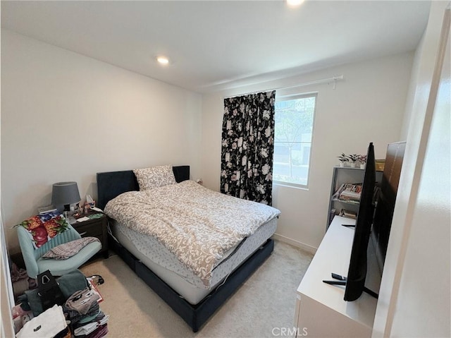 bedroom with recessed lighting and light colored carpet