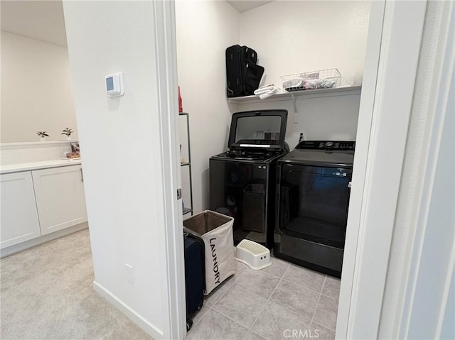 laundry area featuring washing machine and clothes dryer and laundry area