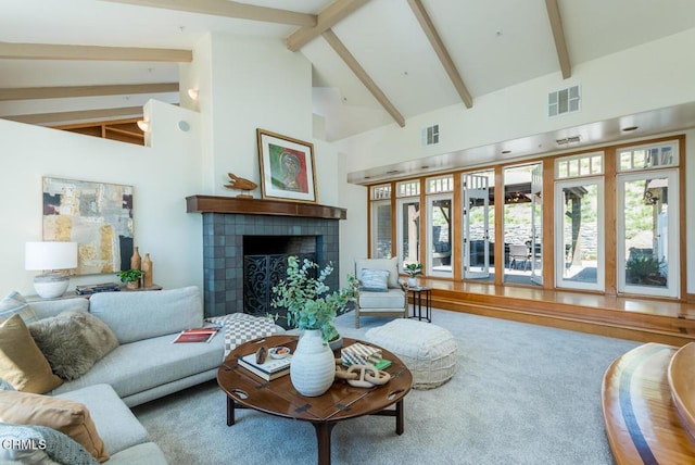 living room with high vaulted ceiling, beam ceiling, a fireplace, and carpet