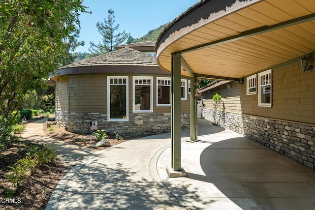 view of patio / terrace featuring an attached carport