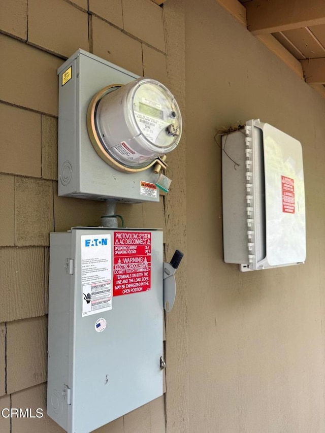 utility room featuring electric meter