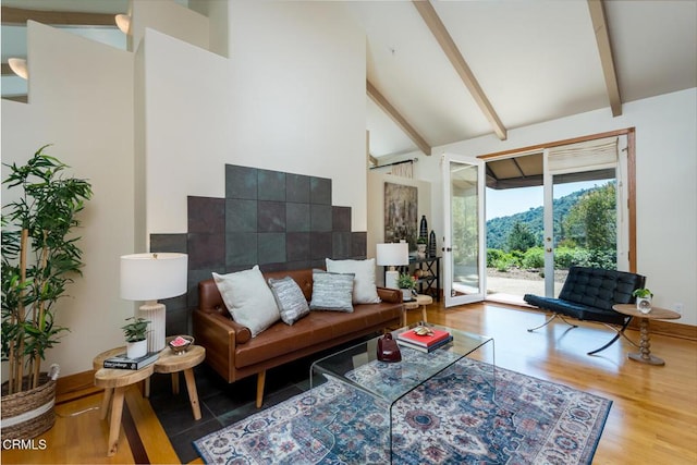 living area featuring high vaulted ceiling, wood finished floors, and beam ceiling