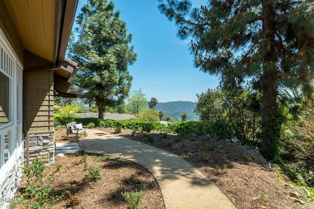 view of yard with a mountain view and a patio area