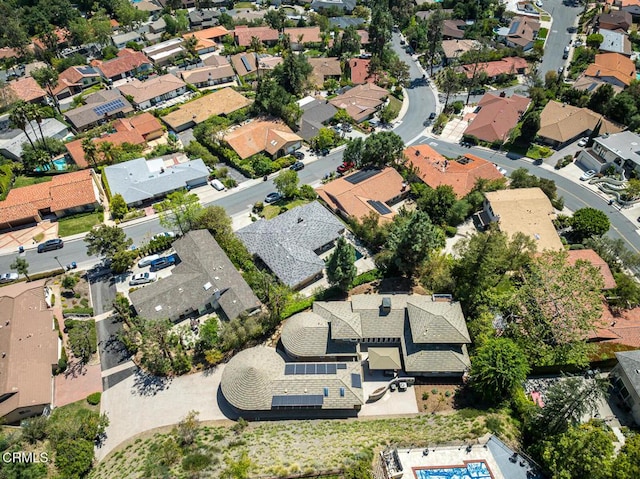 aerial view of property's location featuring nearby suburban area