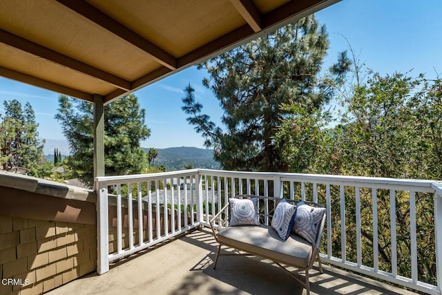 balcony featuring a mountain view