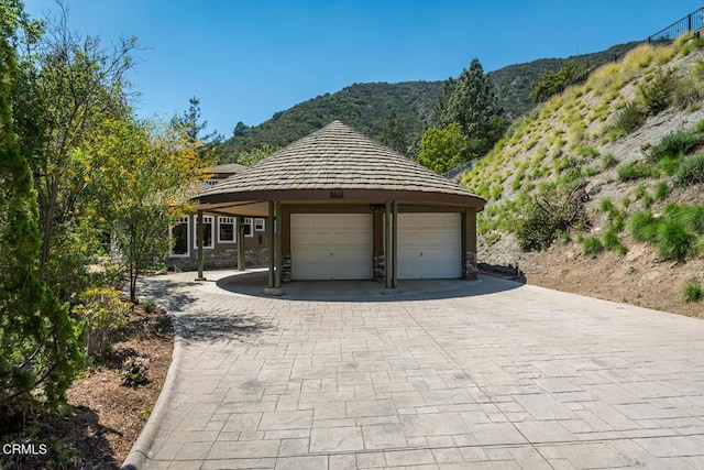 garage featuring a mountain view and a detached garage