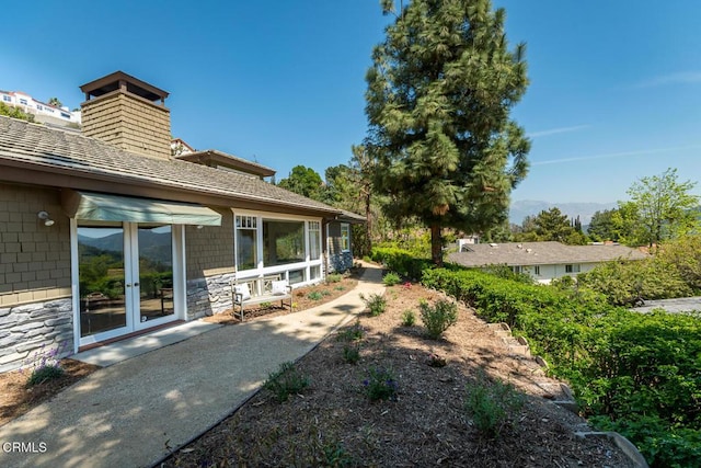 view of yard with french doors
