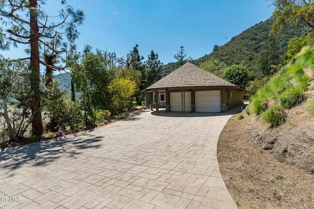 garage featuring a mountain view